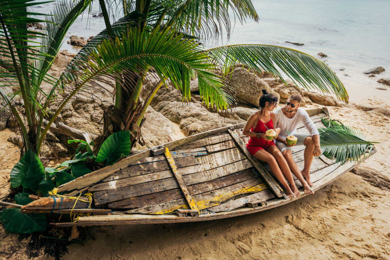 Honeymooners on a beach in Maldives